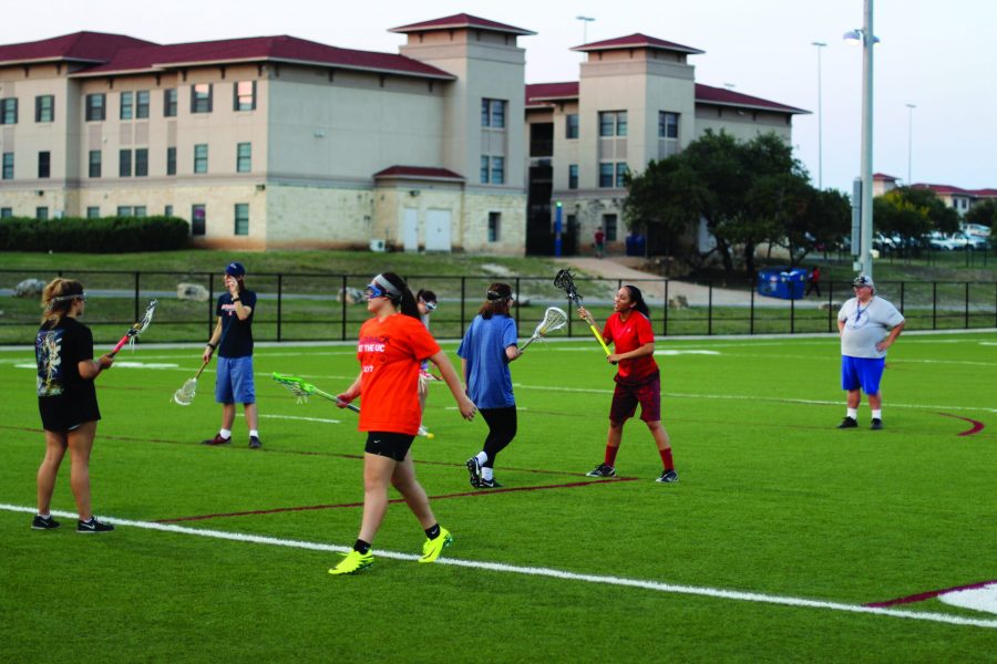 The lacrosse team enjoys a nice evening of practice on the UTSA campus recreation fields. Josh Levario, The Paisano