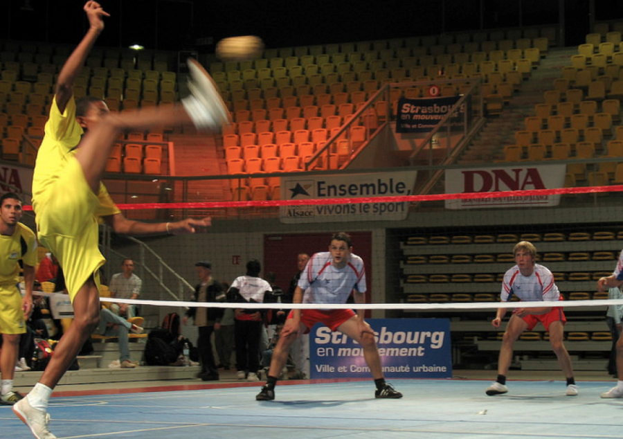 Two teams play a match of Sepak Takraw. Photo Courtesy of Francois Schnell/flickr.com