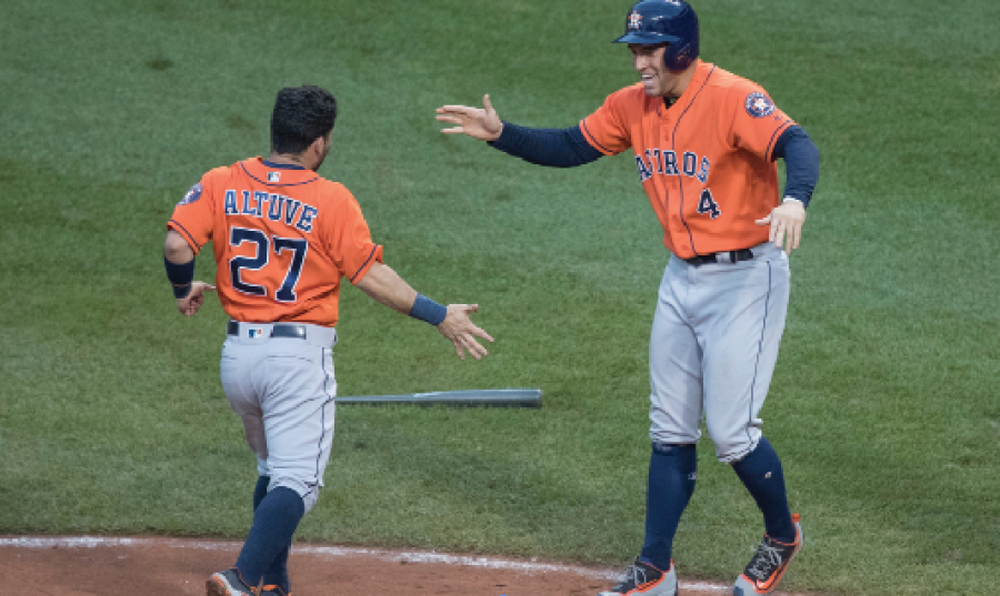 Altuve and Springer celebrate after they score a run. Keith Allison/Flickr.com