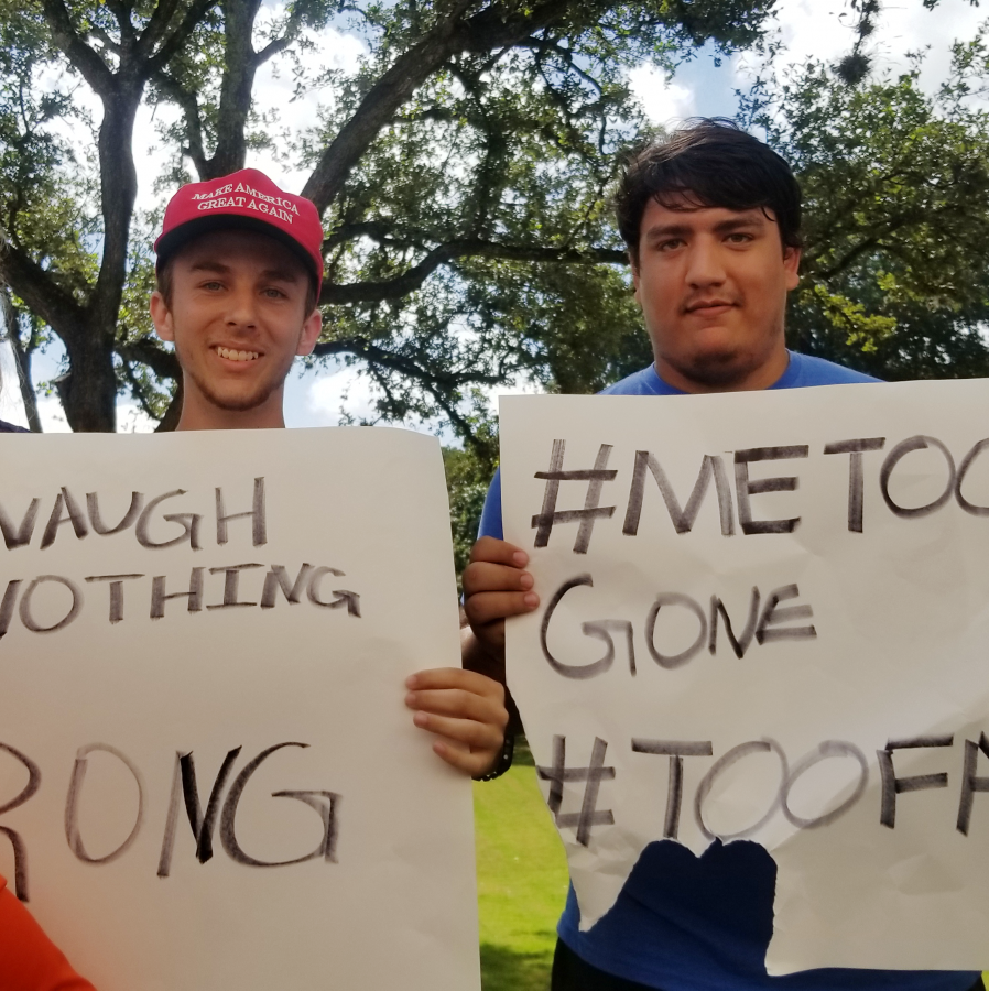 Joey Rubbico and Peyton Dillenberg holding signs during protest.