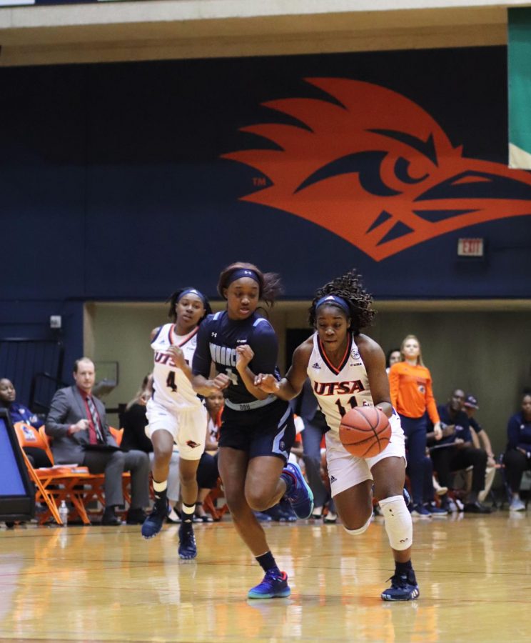 Charlene Mass dribbles around the Old Dominion defense. The Roadrunners lost both games of the
weekend.