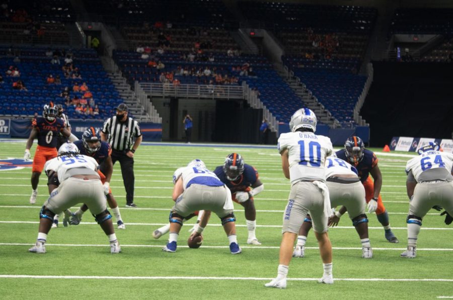 Middle Tennessee quarterback Asher OHara stares down UTSA safety Rashad Wisdom before the snap. The Runners intercepted OHara twice on Friday. 
