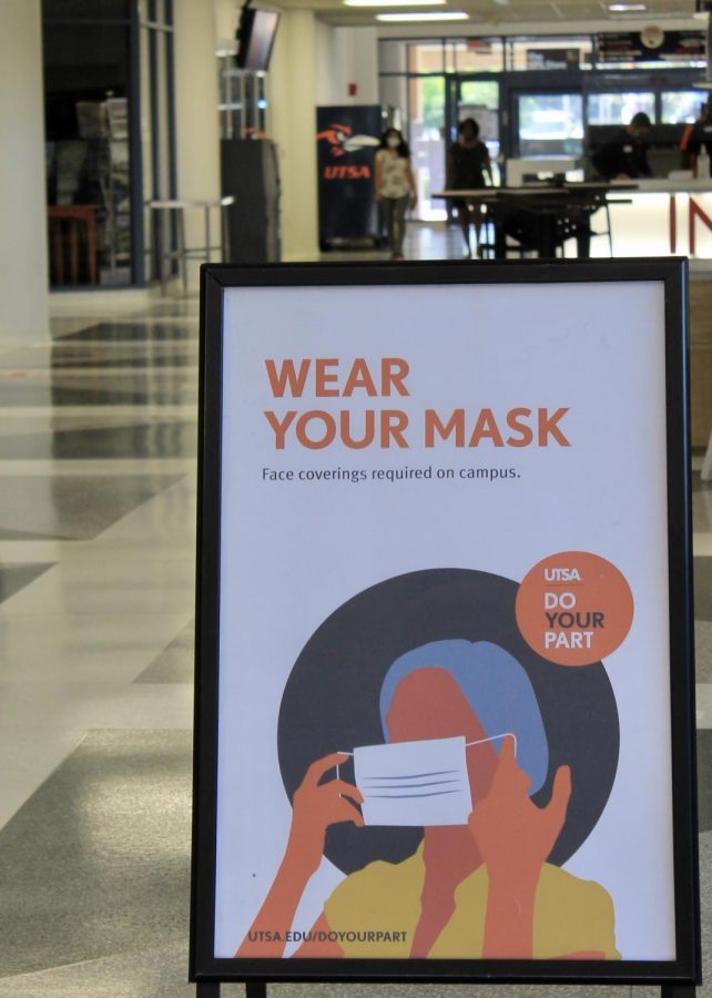 A sign in the Student Union encourages wearing face masks on campus. Dean of Students LT Robinson said violations of safety violations will be dealt with on a case-by-case basis.