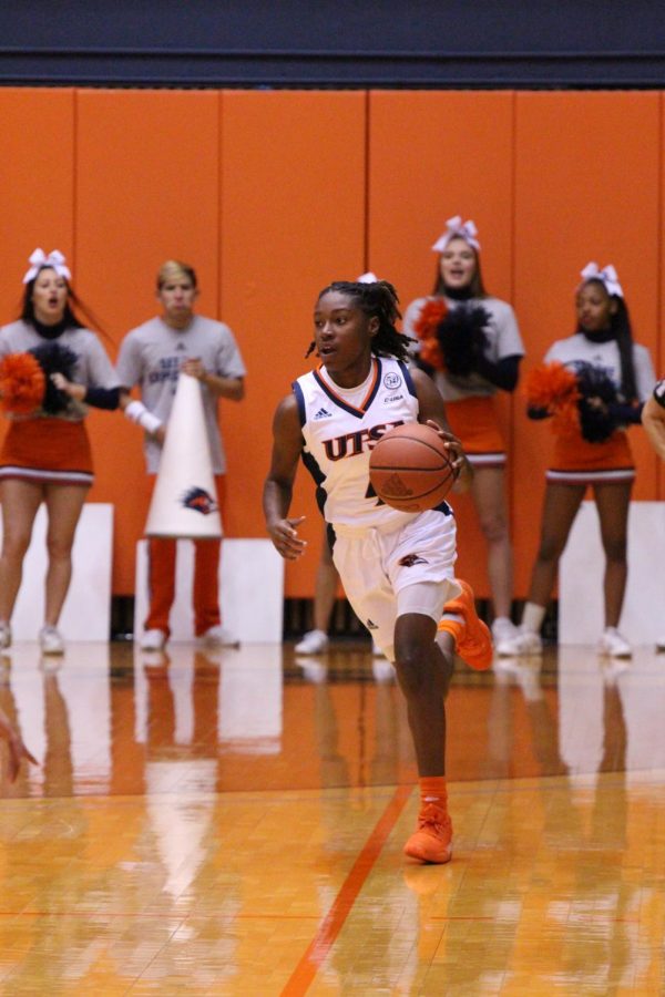 Womens basketballs guard Mikayla Woods dribbles the ball up the court against UIW last season. 