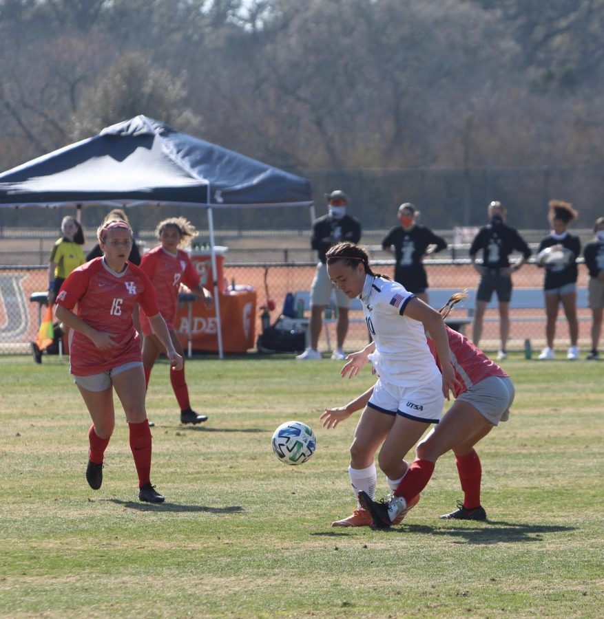 Abby Kassal plays through contact during the game against Houston on Wednesday. Kassal is currently second on the team in shots taken with 9 and is tied for most shots on goal with 5.