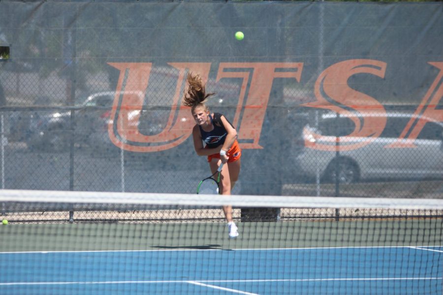 Alexsandra Zlatarova fires a serve over the net during her singles match against Texas-Arlington. Zlatarova has compiled an 11-5 record in singles play and a combined record of 10-5 in doubles.