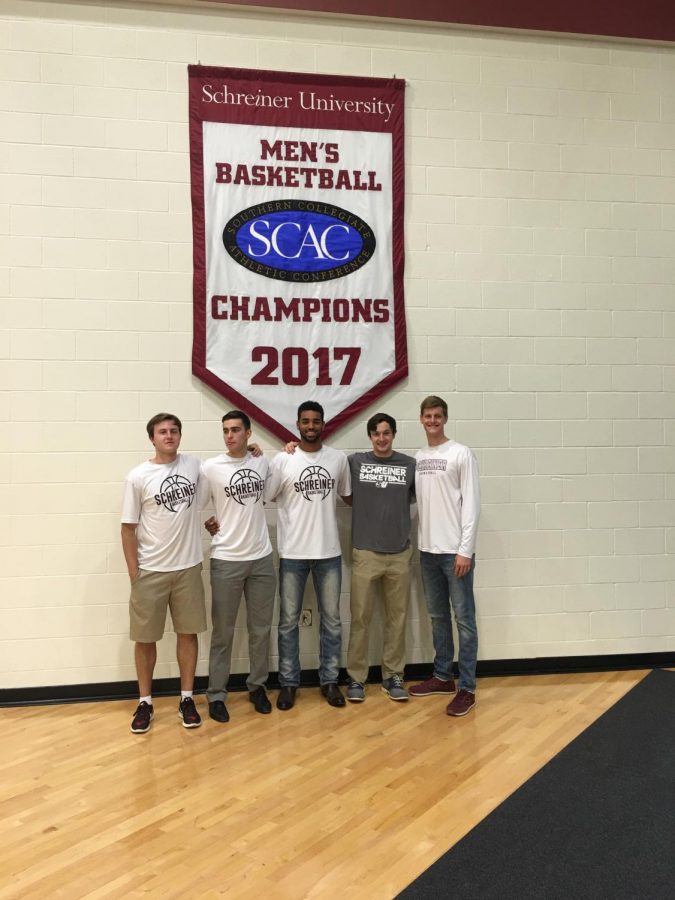 Preston+Bigley+and+teammates+pose+under+their+championship+banner.+Schreiner+University+was+the+Southern+Collegiate+Athletic+Conference+Champions+in+2017.+