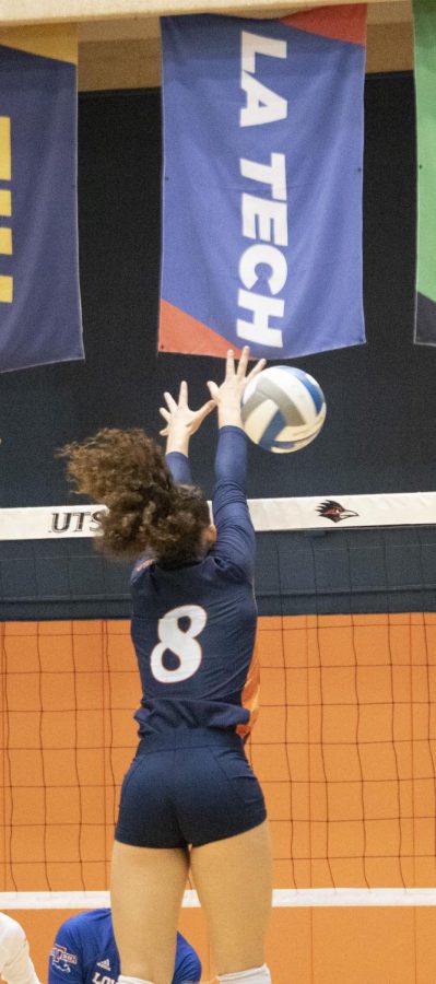 Courtney Walters blocks a shot during this weekends series against LA Tech. Walters recorded four blocks in Fridays victory. Dalton Hartmann/The Paisano
