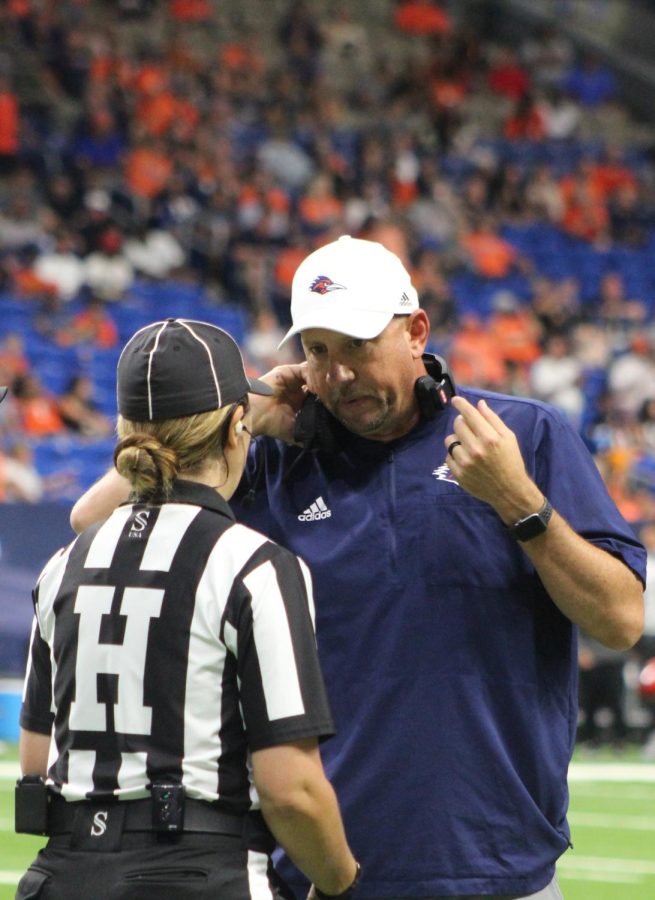 Jeff Traylor consults with an official during a game earlier this season. Traylor spent 15 years as the head coach at Gilmer High School before becoming an assistant at Texas for two season followed by one-year stints as the running backs coach and associate head coach at SMU and Arkansas. Seva Hester/The Paisano