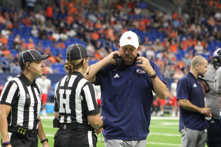 Jeff Traylor confers with the officials during a game against UNLV last season. Traylor enters year three of his tenure as the head coach of the Roadrunners with an overall record of 19-8, but remains in search of the programs first ever bowl game victory. 