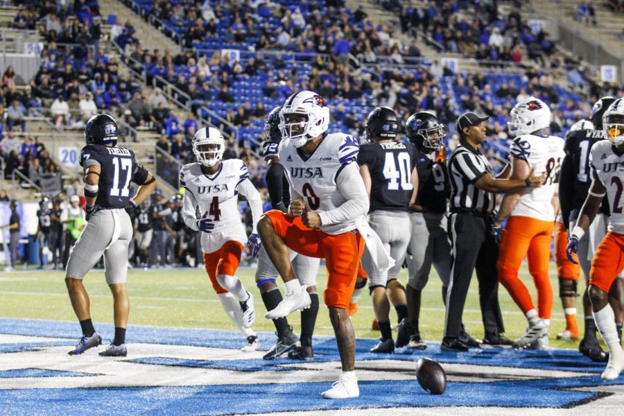 Frank Harris celebrates in the endzone after rushing for a touchdown. Harris had four touchdowns against Middle Tennessee, and a program record of 414 passing yards. 