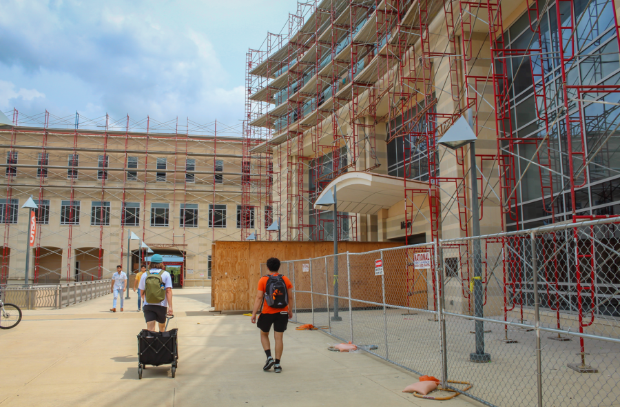 Students walk by the Main Building, which has been under construction for over a year.