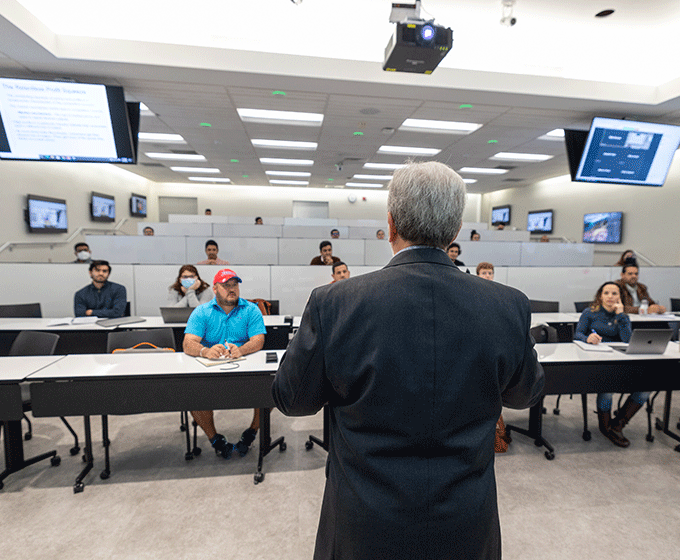 Business professor Daniel J. Davied lectures his M.B.A. class in business foundations.