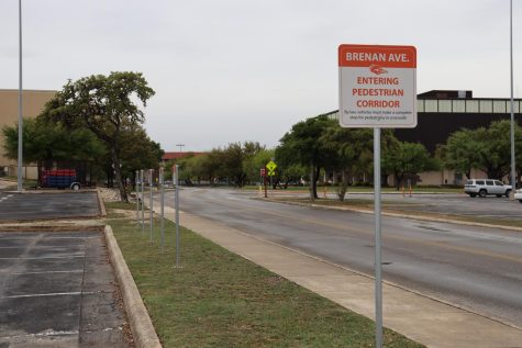 Traffic signs along Brenan Avenue signal shared roads