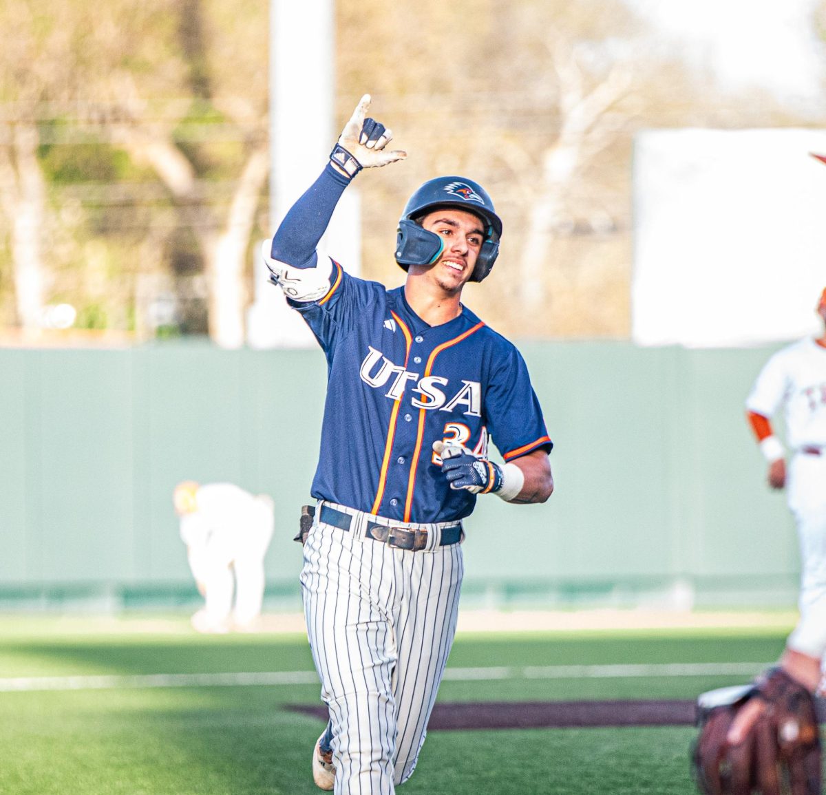 Caden Miller rounds the bases after launching his first home run of the evening.