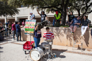 Student plays drums amid dispute with religious protester