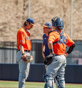 Coach Pat Hallmark speaking to Conor Myles.
