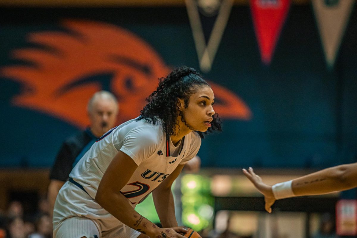 Maya Linton looks to pass the ball as she defends.