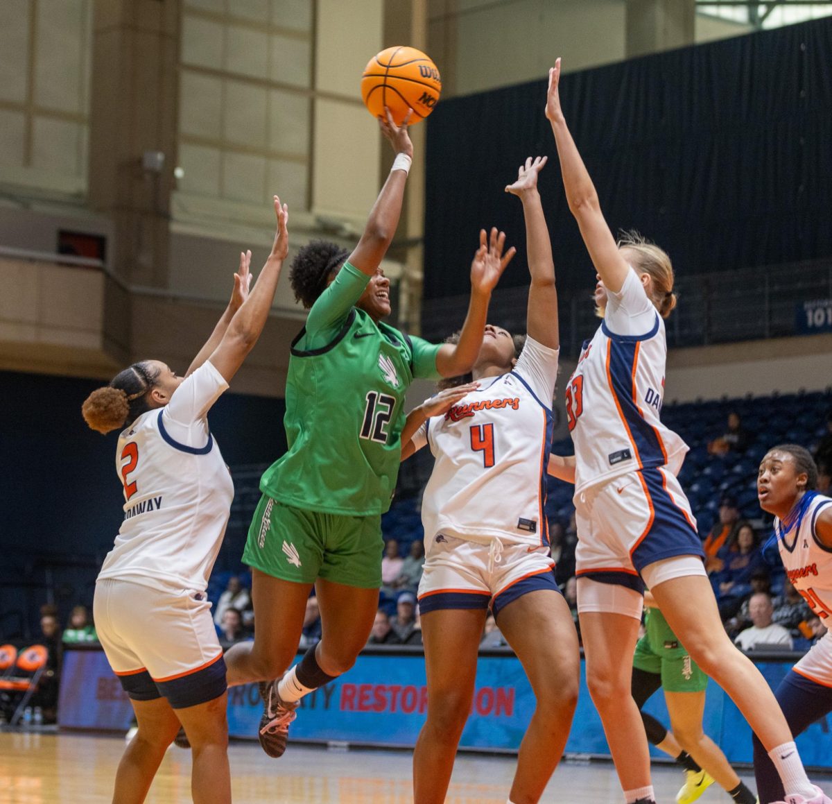Former Roadrunner Aysia Proctor is fouled by three UTSA women's basketball players in the Roadrunners' 66-64 win over North Texas Wednesday, Jan. 28, 2026, at the Convocation Center in San Antonio, Texas.