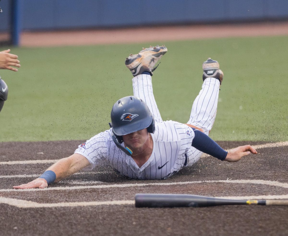 UTSA baseball outfielder Lane Haworth slides into home during the Roadrunners' 8-5 win over Charlotte Friday, Apr. 17, 2026, at Roadrunner Field in San Antonio, Texas. 